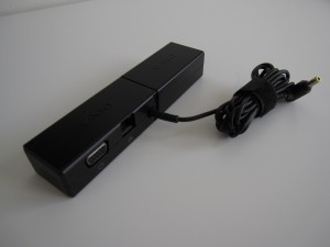 Port replicator combined with AC adapter